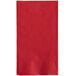 A red paper napkin with a white border.