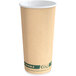 A close-up of an EcoChoice Double Wall Kraft paper hot cup with a white rim and green stripe.