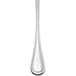 A Libbey stainless steel round soup spoon with a long handle.