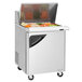 A Turbo Air stainless steel refrigerated sandwich prep table with a variety of vegetables in it.
