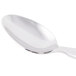 A Libbey stainless steel iced tea spoon with a white handle.