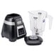 A Waring bar blender with a clear copolyester container and black and silver electronic keypad controls.