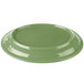 A green porcelain Libbey Cantina platter with a carved design on a white background.