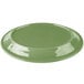 A sage green Libbey porcelain platter with a carved design on a white background.