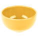 A yellow Libbey porcelain bowl on a white background.