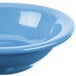 A close up of a blue Libbey Cantina fruit bowl with a white rim.