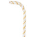 A close-up of a Creative Converting jumbo white and gold striped paper straw with a curved end.