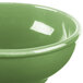 A close up of a white Libbey Cantina oatmeal bowl with a green interior.
