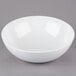 A Tablecraft white melamine bowl.