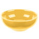 A yellow Libbey Cantina salsa bowl with a white edge on a white surface.