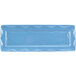 A blue rectangular tray with a wavy design on the edges.
