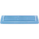 A blue rectangular porcelain tray with a carved surface.
