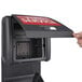 A hand opens a Commercial Zone Vue-T-Ful Isle Windshield Washing Service Center box with a red sign.