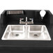 A black and silver Cambro CamKiosk portable hand sink with two faucets and two sinks.