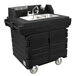 A black plastic Cambro CamKiosk portable self-contained hand sink with wheels.