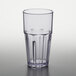 A close-up of a clear plastic GET Bahama tumbler with a black rim.