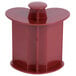 A red plastic pusher for a Robot Coupe commercial food processor.