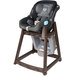 A Koala Kare brown plastic high chair with a grey seat.