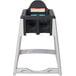 A grey and black Koala Kare KidSitter high chair with a black tray.