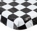 A white rectangular tablecloth with a black and white checkered pattern.