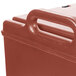 A close-up of a Cambro brick red insulated soup carrier.