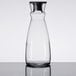An Arcoroc clear glass carafe with a black stopper.