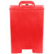 A red plastic container with a lid and handles.
