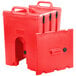 A red plastic Cambro soup carrier with black handles.