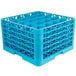 A blue plastic Carlisle OptiClean glass rack with 25 compartments and 5 extenders.