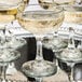 A tray of Libbey Embassy coupe glasses filled with champagne.