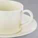 A close up of a white 10 Strawberry Street Royal Cream cup and saucer.