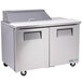 A True stainless steel refrigerated sandwich prep table with two doors.