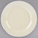 A white porcelain luncheon plate with a small white rim.
