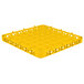 A yellow plastic Carlisle glass rack extender with compartments and holes.