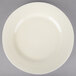 A close up of a 10 Strawberry Street Royal Cream porcelain dinner plate with a small rim on a white background.