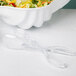Clear plastic Fineline salad tongs serving a salad in a bowl.