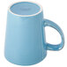 A close-up of a Libbey blue porcelain mug with a white handle.