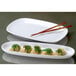 A Libbey ultra bright white porcelain coupe tray with dumplings and chopsticks on it.