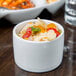 A bowl of pasta in a Libbey Ultra Bright White Canne Bowl.