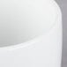 A close up of a Libbey Ultra Bright White Porcelain Canne Bowl with a white rim.