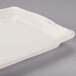 A white rectangular porcelain tray with a white decorative edge.