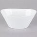 A Libbey Neptune bowl in white porcelain on a gray background.