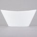 A Libbey Neptune bowl with a curved edge on a white background.