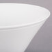 A close-up of a Libbey ultra bright white porcelain Normandy bowl with a rim.