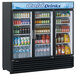 A Turbo Air black three section glass door merchandising refrigerator filled with drinks and beverages.