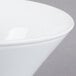 A close up of a Libbey white porcelain bowl with a white rim.