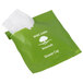 A green plastic bag with white text that reads "Basic Earth Botanicals" containing a shower cap box with a green and white label.