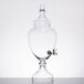 A clear glass Fifth Avenue Crystal Winston 1 gallon beverage dispenser with a spigot valve on top.
