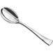 A Visions silver plastic tasting spoon with a silver spoon and handle.
