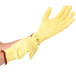 A pair of large yellow Cordova Cut Resistant Gloves with red trim.